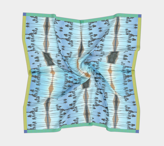 Wavy silk scarf showcasing a mirrored design inspired by Haleakalā Volcano and tropical scenery, created by Leeloo + Zohan, named Haleakalā Horizon.