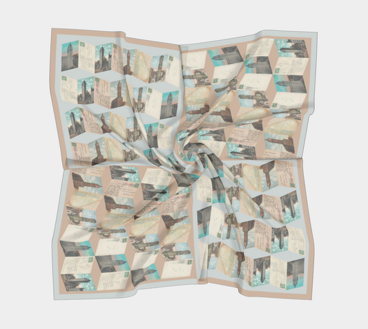 The Manhattan Towers 2.0 scarf by Leeloo + Zohan elegantly displayed, highlighting its unique geometric patchwork of vintage New York City postcards.