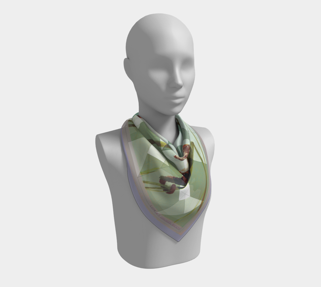 Model displaying the New York Aquarium sea-horse scarf by Leeloo + Zohan, highlighting the elegant design and luxurious silk fabric.