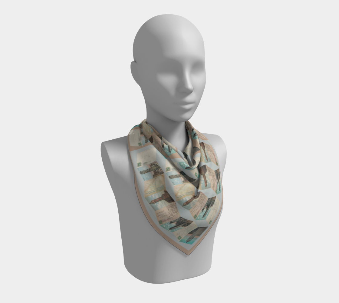 The Manhattan Towers 2.0 scarf by Leeloo + Zohan worn stylishly on a mannequin, showcasing its luxurious silk habotai material and unique New York City design.