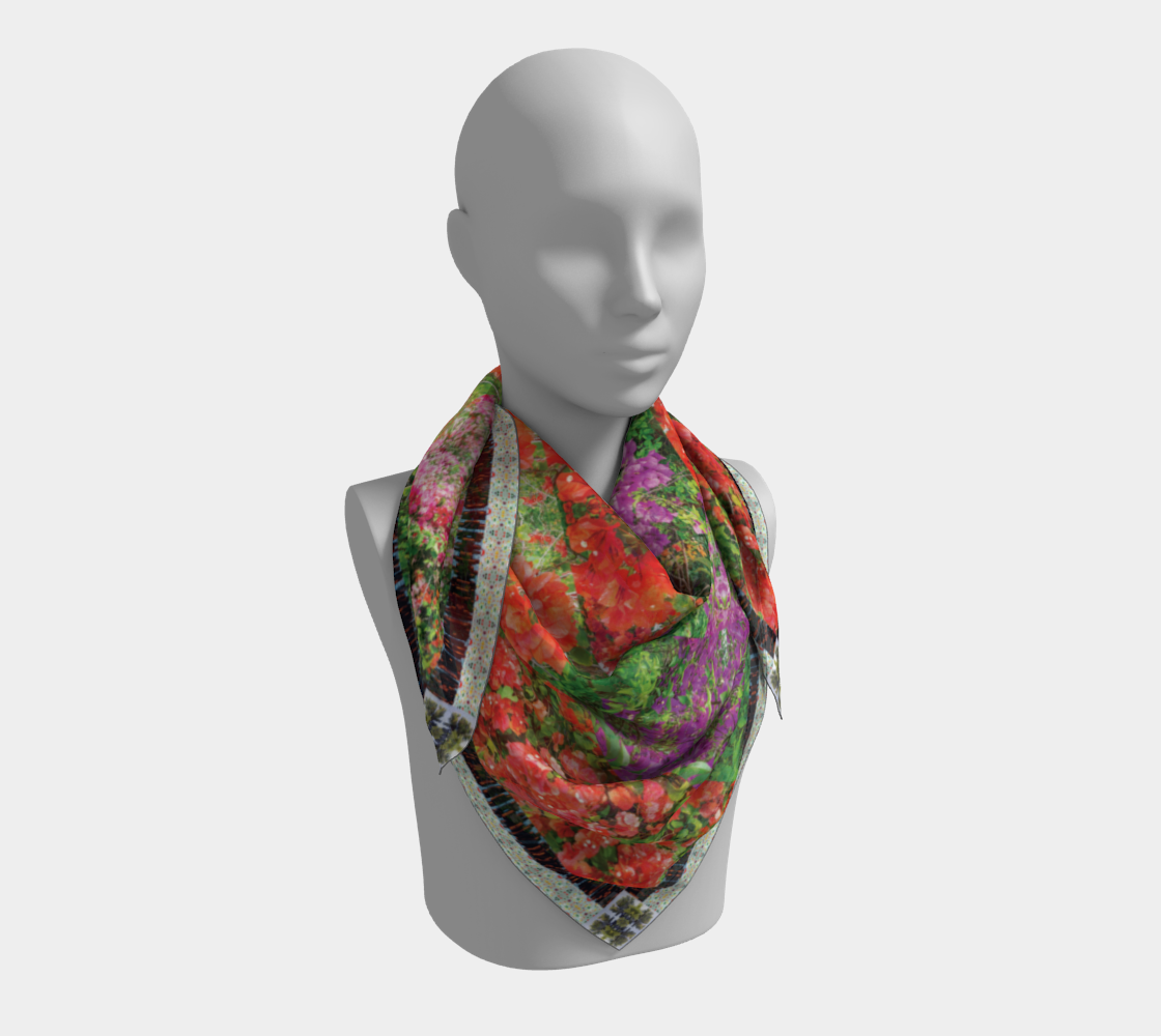 Maui Bloom scarf by Leeloo + Zohan on a mannequin, displaying its vibrant floral design and luxurious texture.