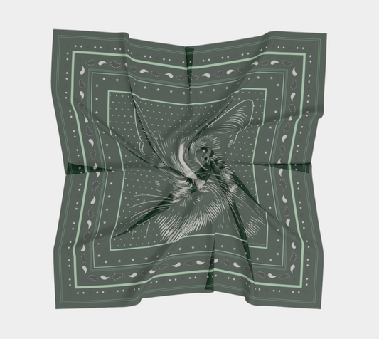 Le Chat Leeloo silk scarf displayed in a draped position, showcasing its intricate cat illustration and design by Leeloo + Zohan.